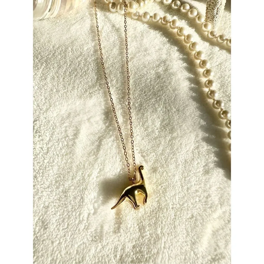 Gold color brachiosaurus pendant necklace